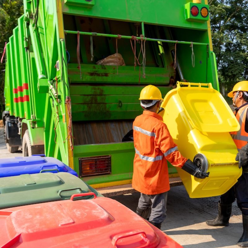 Two Workers collecting garbage of urban municipal are collecting for trash removal. Garbage collector. Two Workers collecting garbage of urban municipal are collecting for trash removal. Garbage collector.